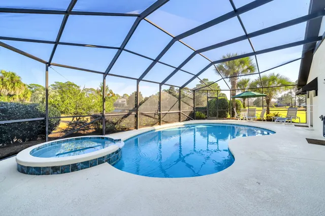 a view of a swimming pool with a porch