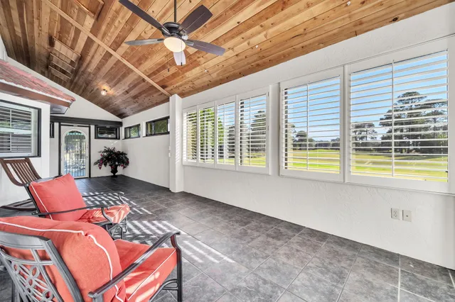 an aerial view of a houses with ocean view