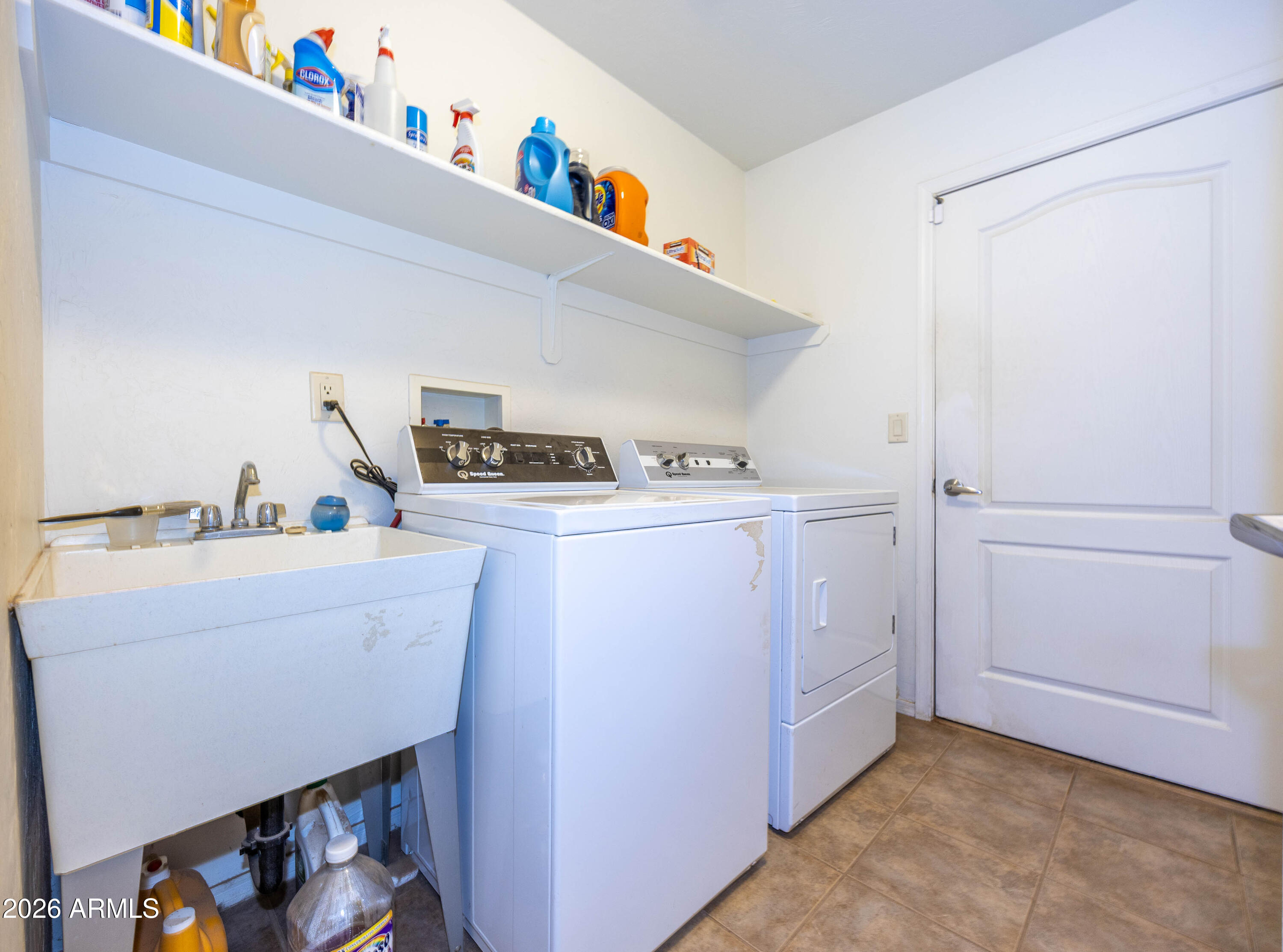 4575 South Kino Road Sierra Vista, AZ 85650 - Photo 19 of 25 a utility room with dryer and washer