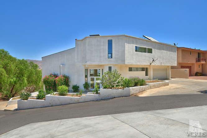 5940 Hilltop Road Simi Valley, CA 93063 - Photo 1 of 34 a front view of a house with a yard and a garage