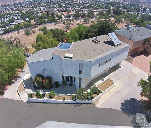 5940 Hilltop Road Simi Valley, CA 93063 - Photo 2 of 34 an aerial view of a house with a yard and lake