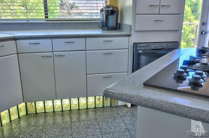 5940 Hilltop Road Simi Valley, CA 93063 - Photo 12 of 34 a kitchen with stainless steel appliances granite countertop a stove a sink and a microwave