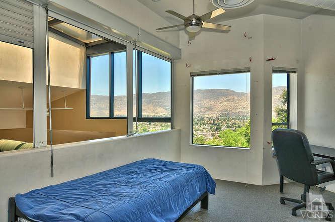 5940 Hilltop Road Simi Valley, CA 93063 - Photo 19 of 34 a bedroom with a bed and a window