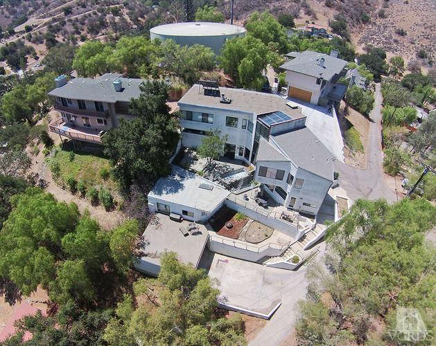 5940 Hilltop Road Simi Valley, CA 93063 - Photo 3 of 34 an aerial view of a house with table and chairs under an umbrella