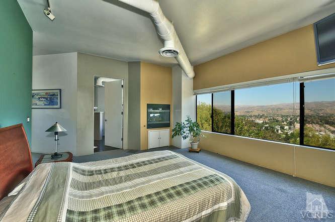 5940 Hilltop Road Simi Valley, CA 93063 - Photo 21 of 34 a bedroom with a bed and large window