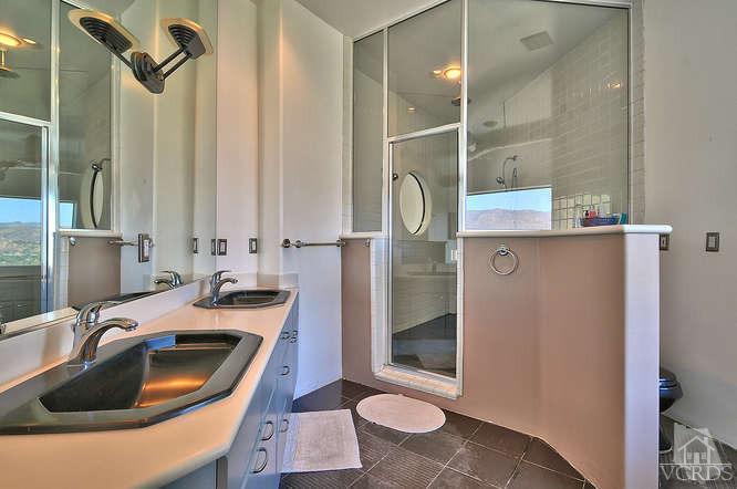 5940 Hilltop Road Simi Valley, CA 93063 - Photo 22 of 34 a bathroom with a sink a toilet and shower
