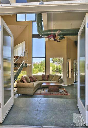 5940 Hilltop Road Simi Valley, CA 93063 - Photo 5 of 34 a living room with furniture and a flat screen tv
