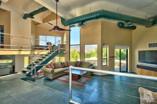 5940 Hilltop Road Simi Valley, CA 93063 - Photo 6 of 34 a view of a hall with furniture and floor to ceiling windows