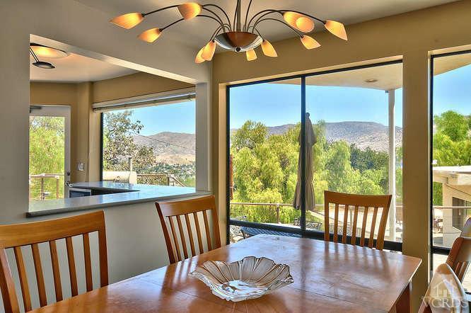 5940 Hilltop Road Simi Valley, CA 93063 - Photo 9 of 34 a view of a dining room with furniture a chandelier and wooden floor