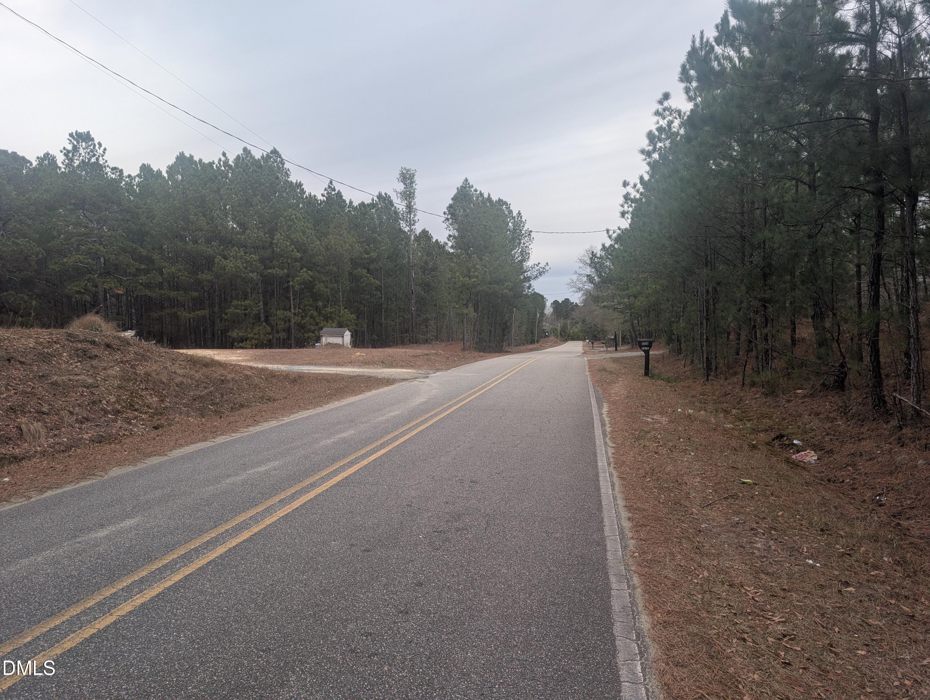 13 Sawgrass Road Eagle Springs, NC 27242 - Photo 3 of 6 a backyard of a house with lots of green space