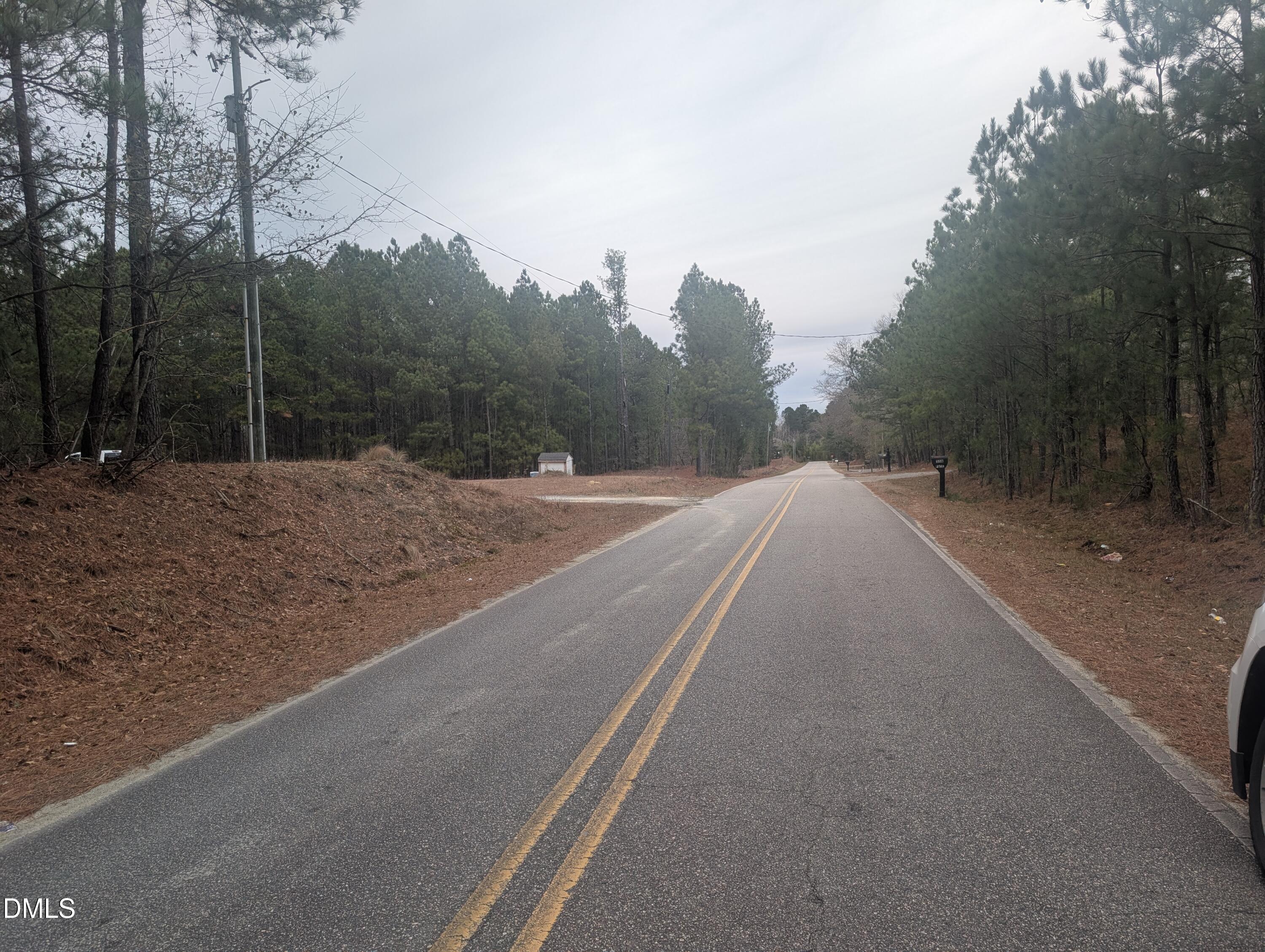 13 Sawgrass Road Eagle Springs, NC 27242 - Photo 6 of 6 a view of a road with a building in the background