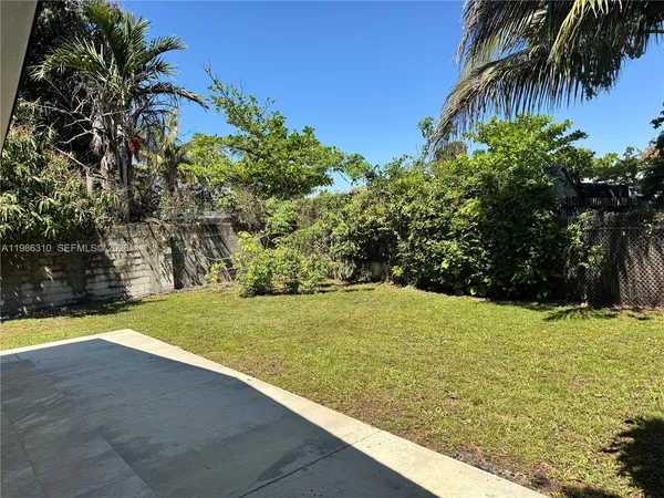 a view of a yard with an outdoor space
