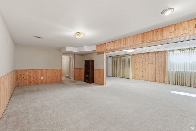 2524 Camelback Road Cottonwood Heights, UT 84121 - Photo 34 of 49 Expansive room featuring light-toned carpeting and wood paneling