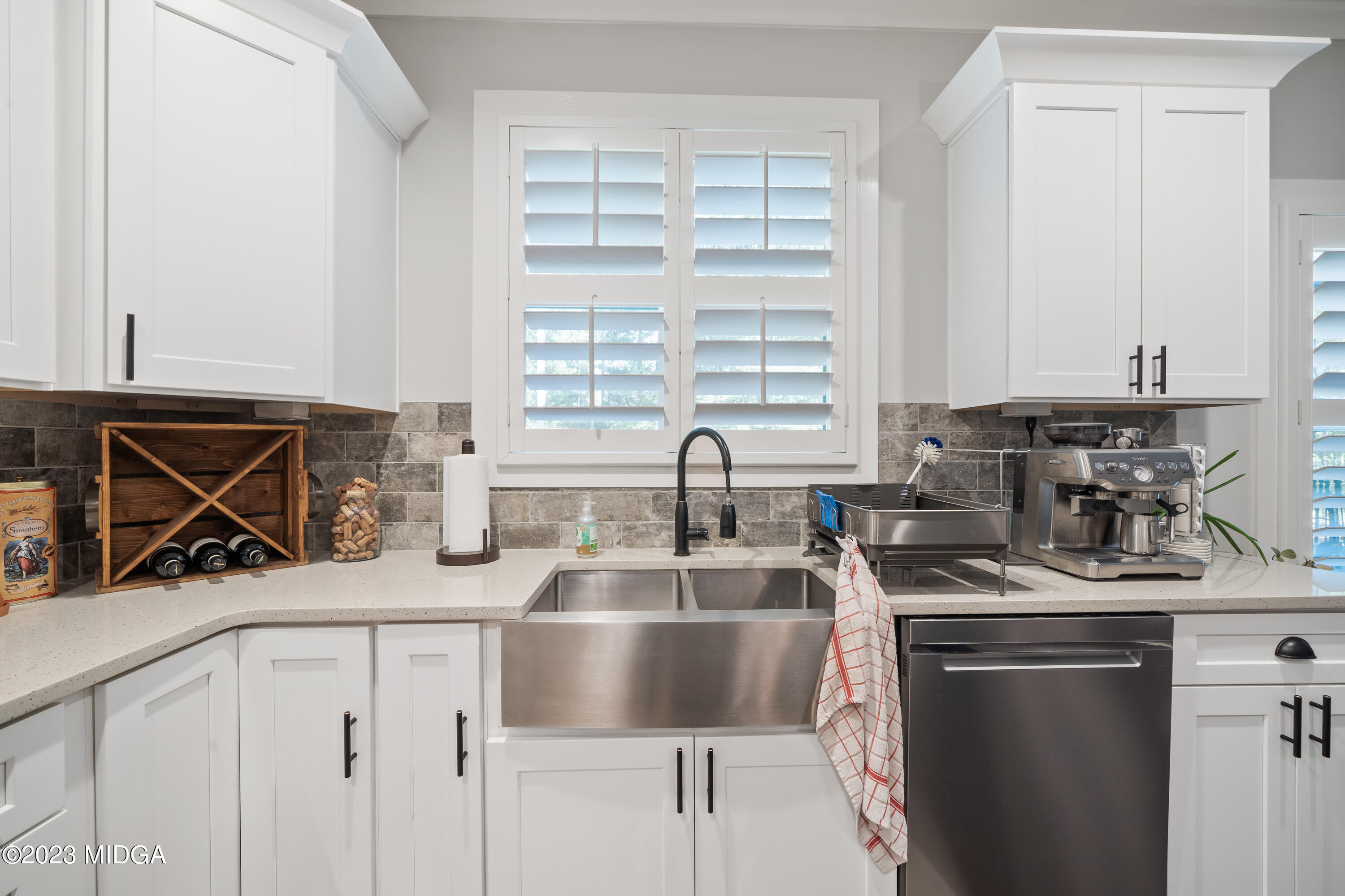 440 Preakness Way Forsyth, GA 31029 - Photo 26 of 51 a kitchen with stainless steel appliances granite countertop a sink stove and cabinets