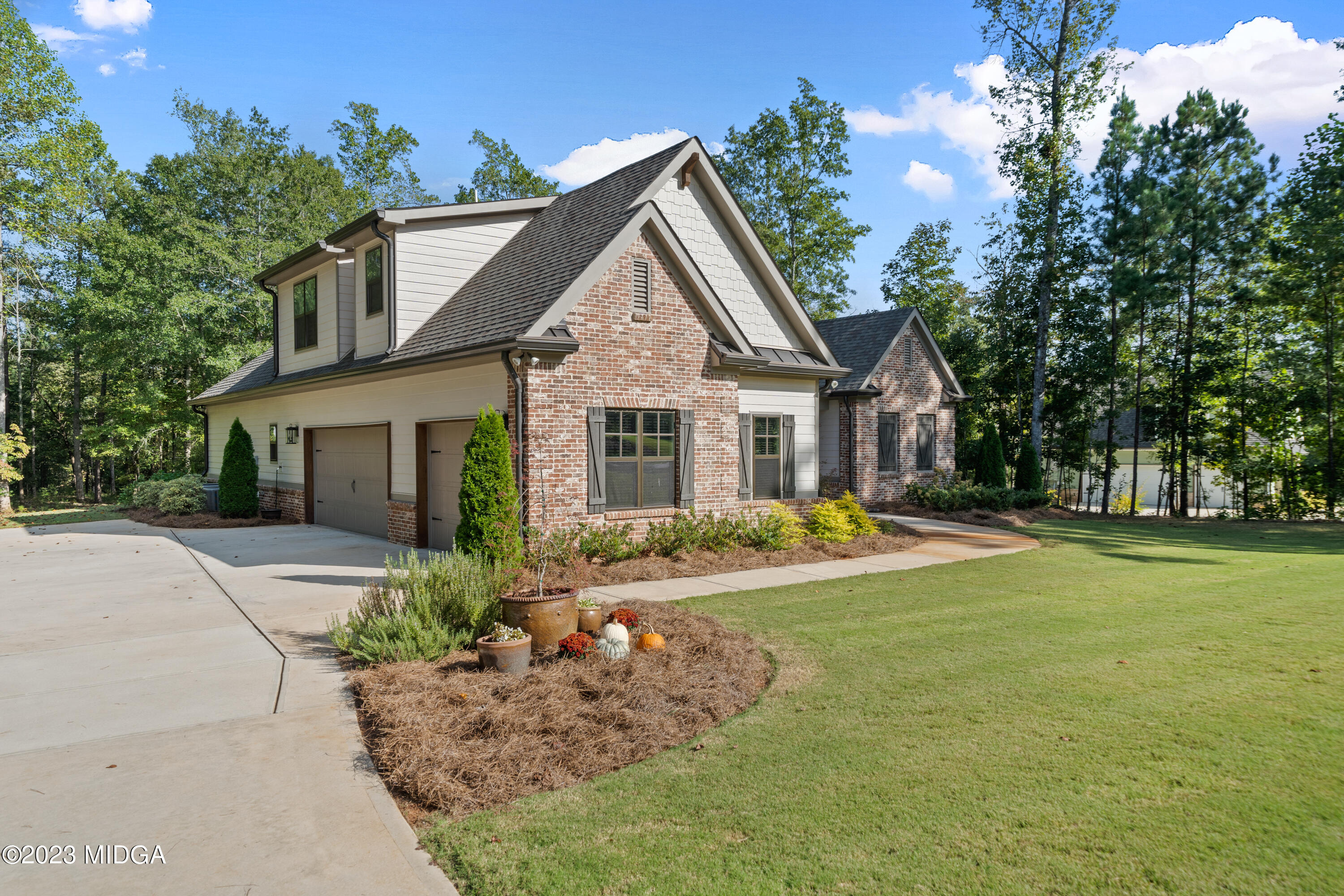 440 Preakness Way Forsyth, GA 31029 - Photo 3 of 51 a view of a house with swimming pool and garden