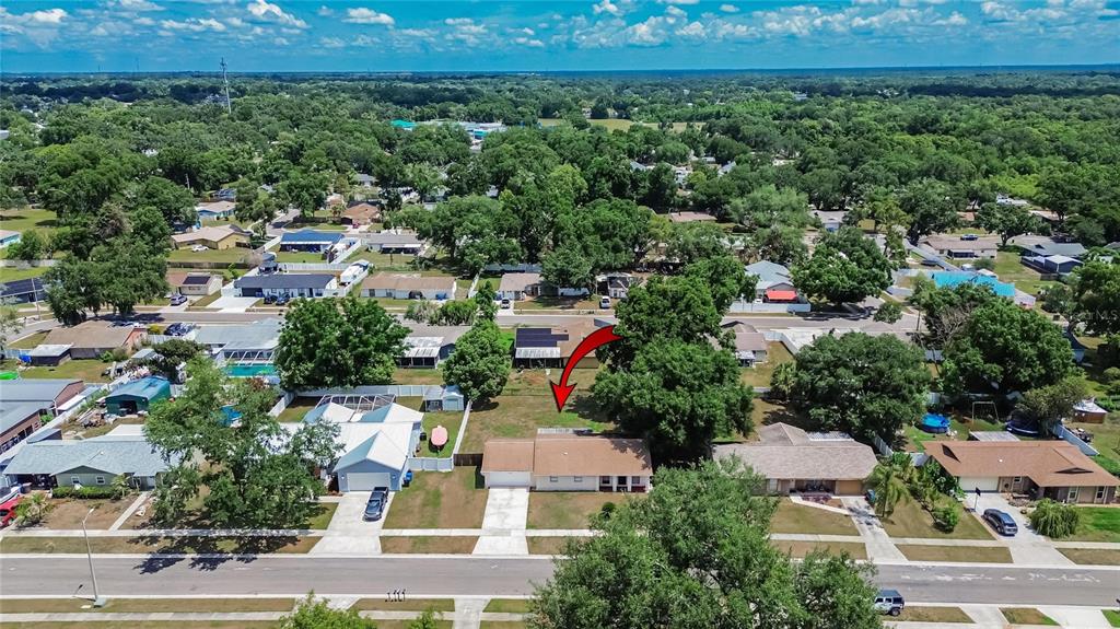 2340 Merrily Circle South Seffner, FL 33584 - Photo 50 of 52 an aerial view of residential houses with outdoor space and trees