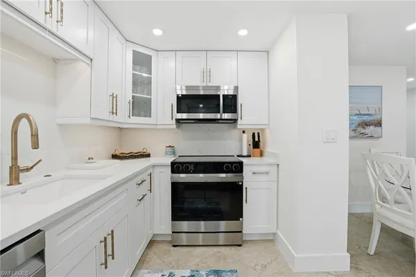 a bedroom with a bed and a television