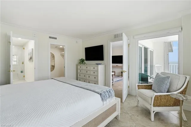 a bedroom with a bed and a night stand