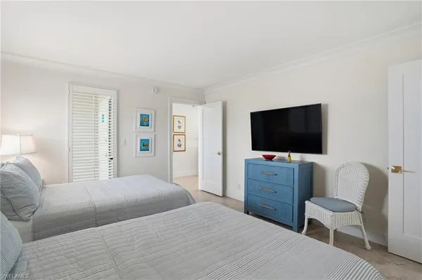 a bathroom with a granite countertop sink a toilet and a shower