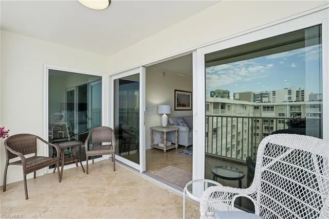 a view of a balcony with furniture