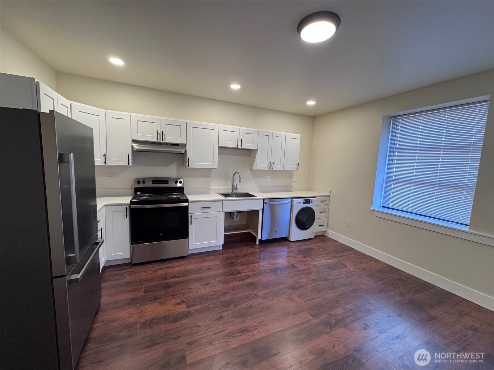 101 Southwest 2nd Street Chehalis, WA 98532 - Photo 17 of 21 a kitchen with refrigerator and cabinets