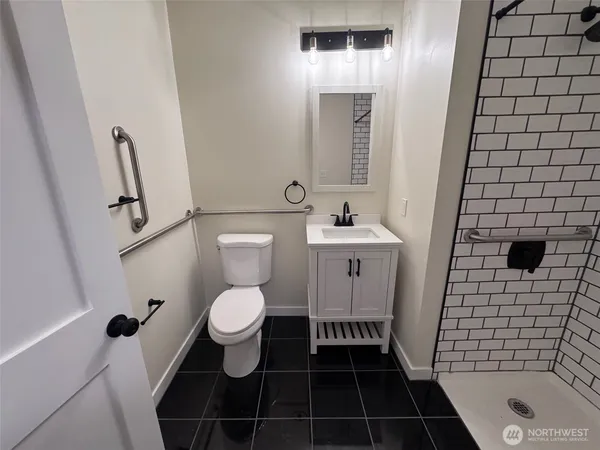 a bathroom with a toilet and a sink