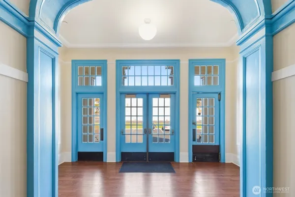 a view of an entryway with wooden floor