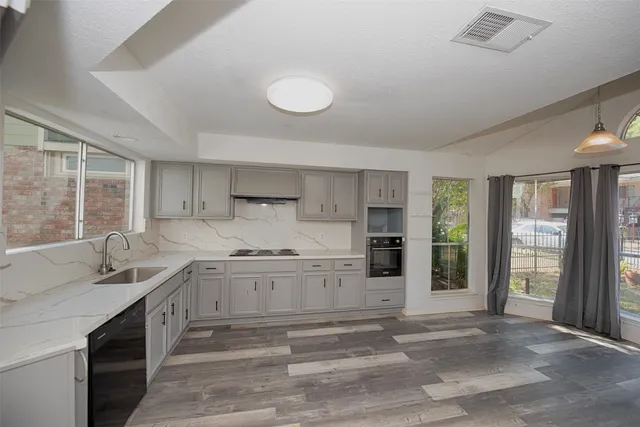 a view of entryway and hall with a fireplace