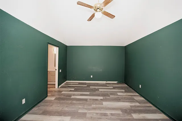a kitchen with granite countertop a sink stainless steel appliances and cabinets