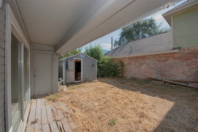 a view of backyard with a barn and a sink