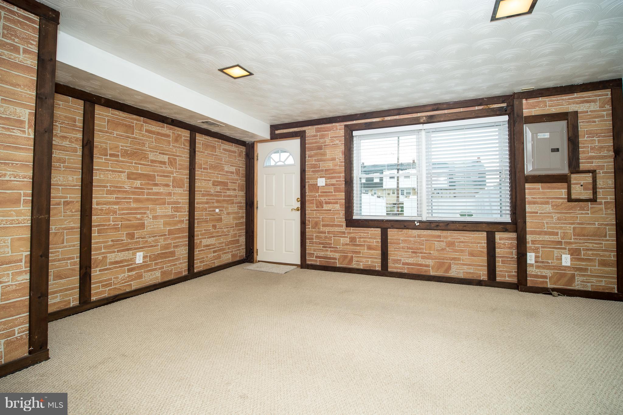 3639 Clarenell Road Baltimore, MD 21229 - Photo 16 of 24 Living Room with Rear Entrance to Yard and Parking