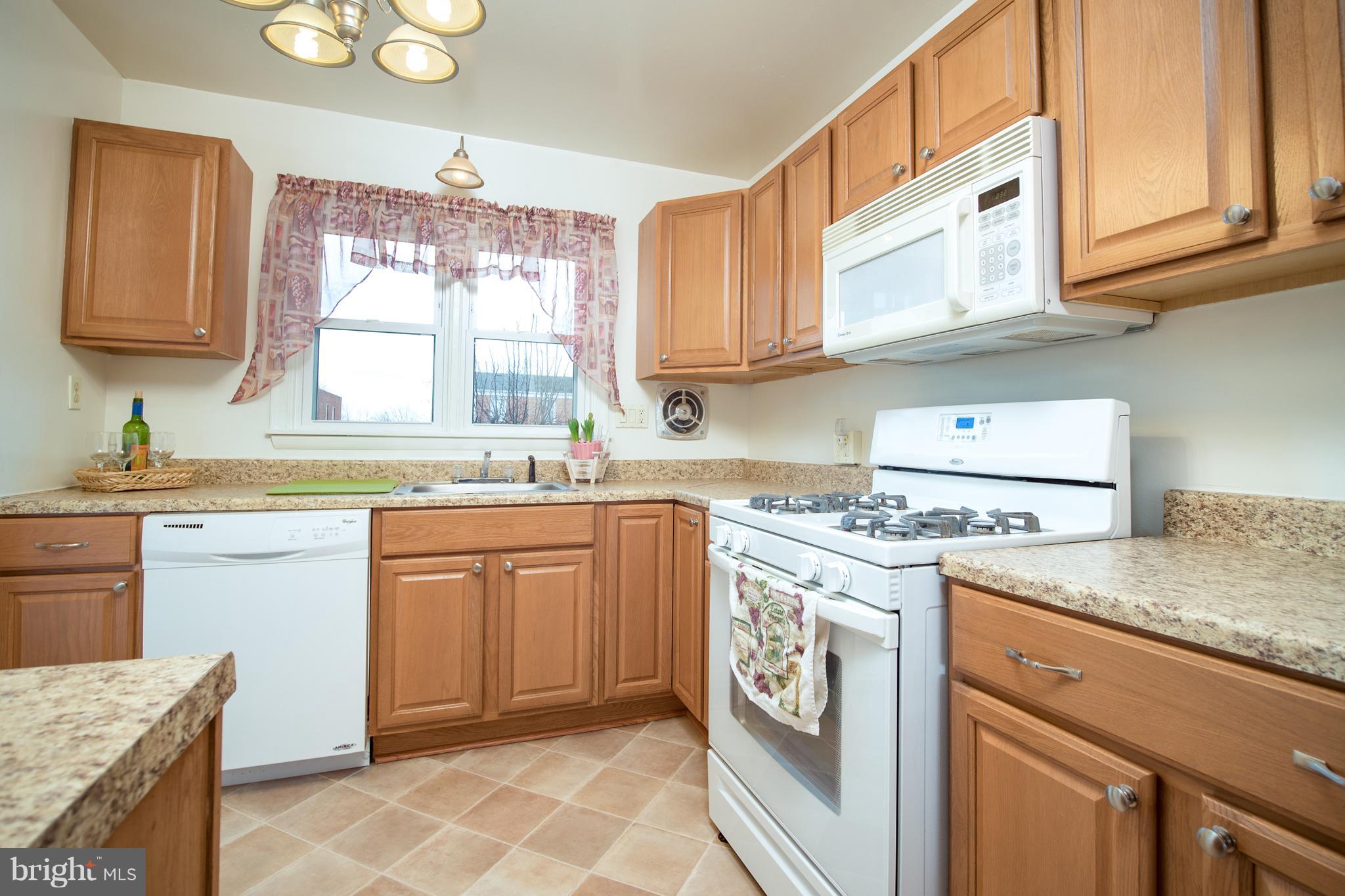 3639 Clarenell Road Baltimore, MD 21229 - Photo 3 of 24 Kitchen with gas stove and dishwasher.