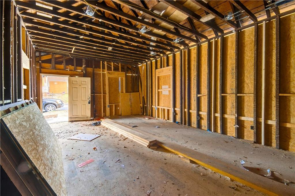913 Smith Street Southwest Atlanta, GA 30310 - Photo 15 of 43 a view of a porch with wooden floor and a yard