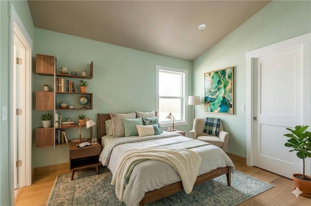 913 Smith Street Southwest Atlanta, GA 30310 - Photo 21 of 43 a bedroom with a bed table and a potted plant