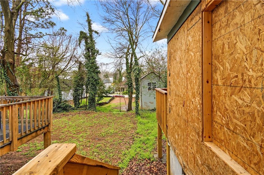 913 Smith Street Southwest Atlanta, GA 30310 - Photo 24 of 43 a view of backyard with wooden fence and large trees