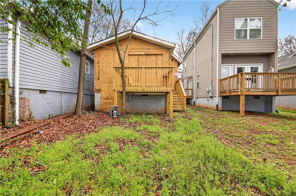 913 Smith Street Southwest Atlanta, GA 30310 - Photo 27 of 43 a backyard of a house with wooden fence and porch