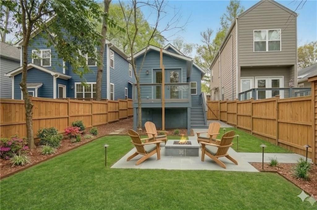913 Smith Street Southwest Atlanta, GA 30310 - Photo 28 of 43 a view of a chair and table in backyard of the house