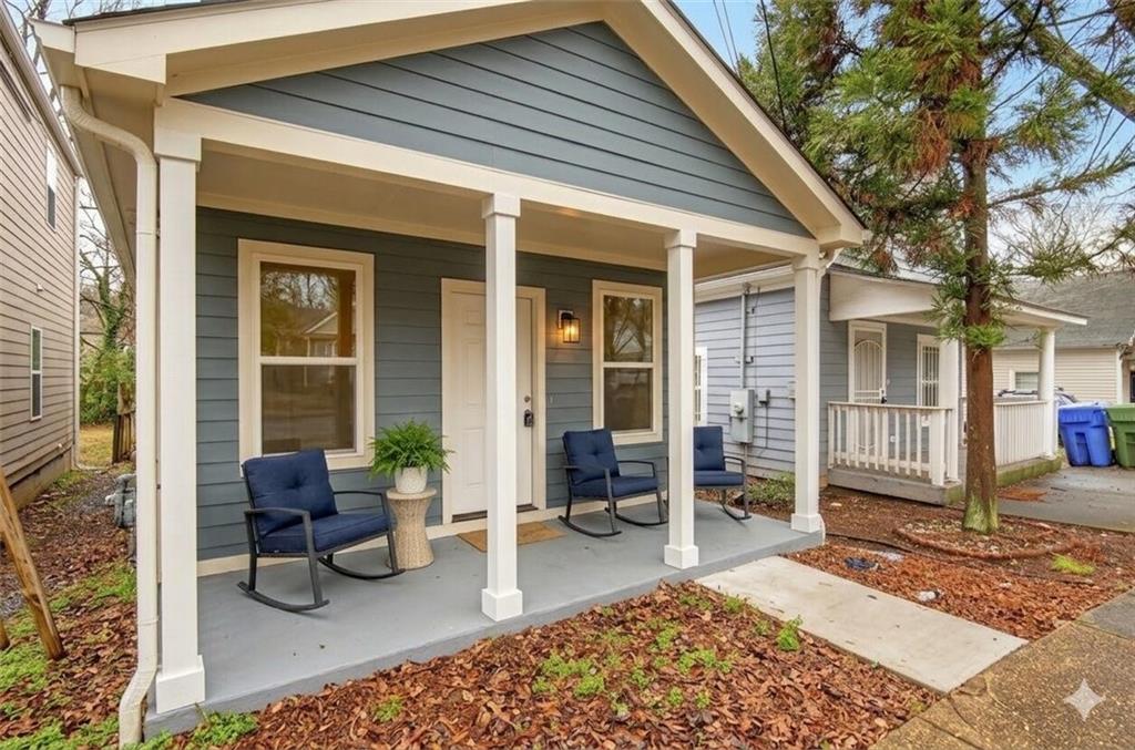 913 Smith Street Southwest Atlanta, GA 30310 - Photo 4 of 43 a view of a balcony with chairs and a patio