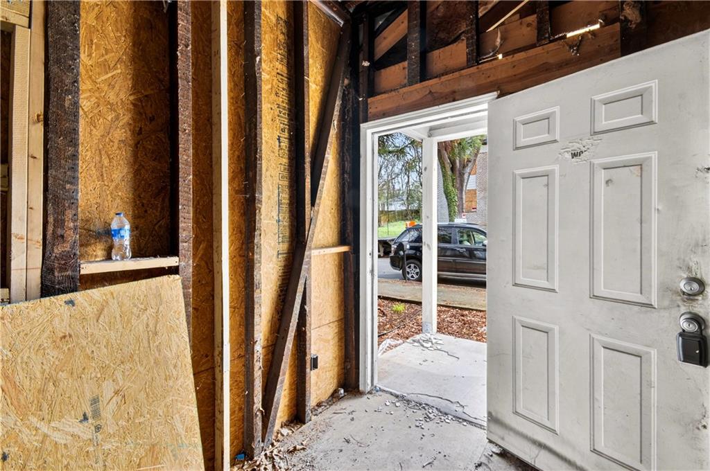 913 Smith Street Southwest Atlanta, GA 30310 - Photo 10 of 43 a view of a hallway with wooden floor and a living room