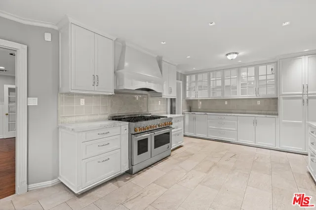 a kitchen with stainless steel appliances cabinets and a sink