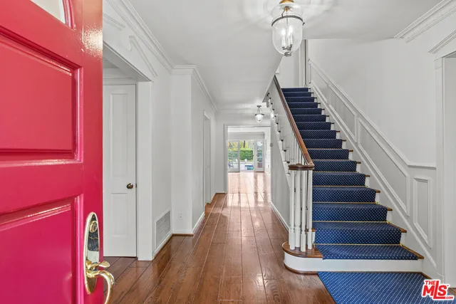 a view of entryway with wooden floor