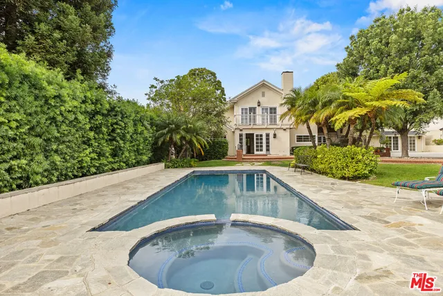 a view of a house with swimming pool