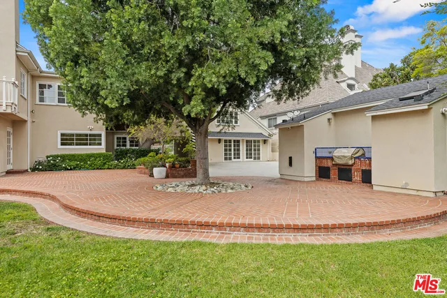 a view of a house with a yard and garage