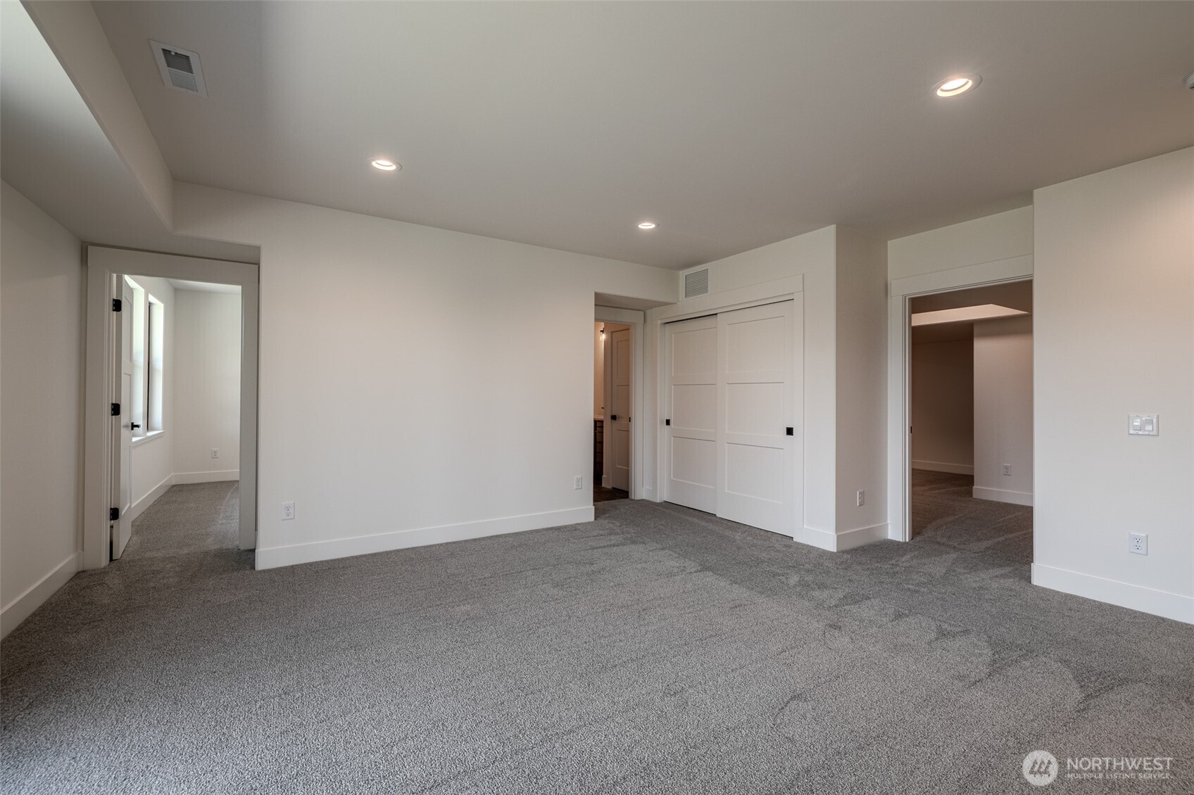 958 Racine Spgs Drive Wenatchee, WA 98801 - Photo 16 of 25 an empty room with closet and wooden door
