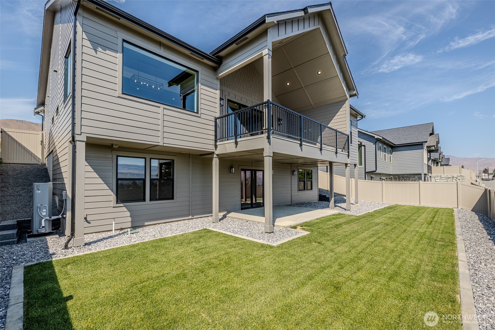 958 Racine Spgs Drive Wenatchee, WA 98801 - Photo 22 of 25 a view of a white house with a swimming pool