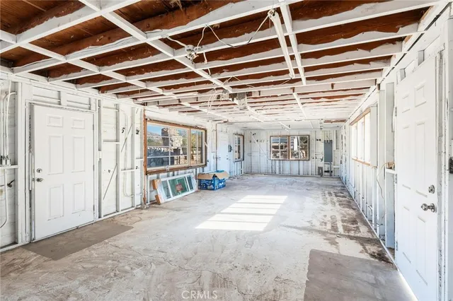 a view of a house with a snow in the background