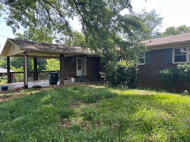 218 Maple Drive Cedartown, GA 30125 - Photo 1 of 1 a view of a house with backyard and sitting area