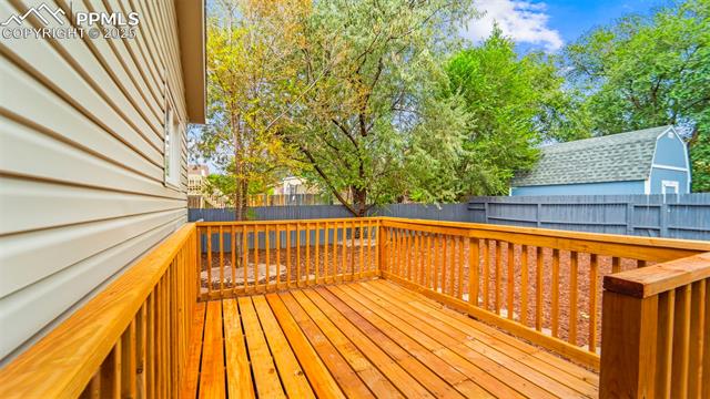 562 Blossom Field Road Fountain, CO 80817 - Photo 38 of 41 Brand new Wooden deck featuring a fenced backyard