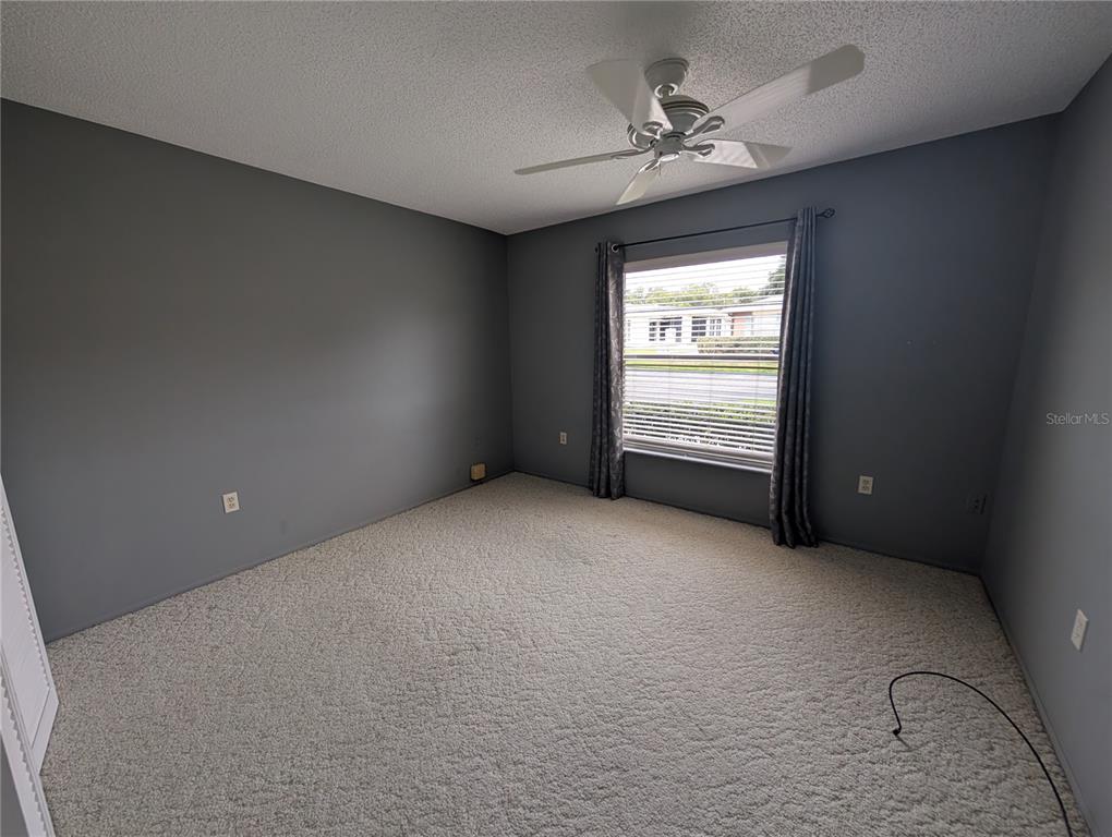 8161 Braddock Circle, Unit 1 Port Richey, FL 34668 - Photo 20 of 27 a view of an empty room with a window