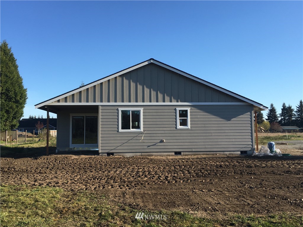 8420 183rd Avenue Southwest Rochester, WA 98579 - Photo 3 of 11 a front view of a house with a garden